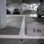 Place de parking dimension : mesures en bataille, épi et en créneau